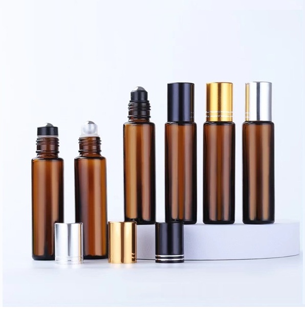 Amber essential oil roller on glass bottle with roll on ball